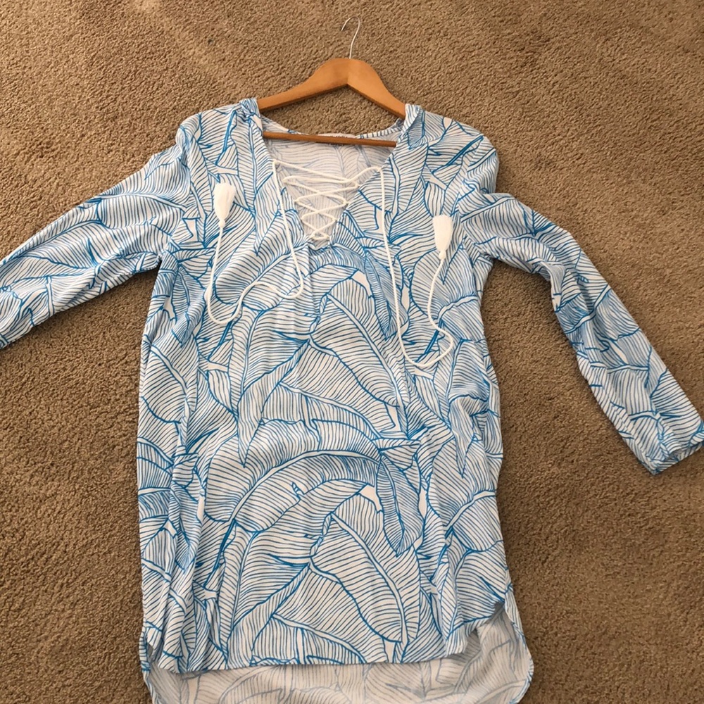Bright, tropical beach cover up.  3/4 sleeve.  Hooded. Never been worn.